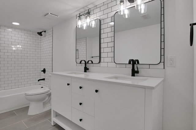 full bathroom with tasteful backsplash, a sink, shower / bathing tub combination, and toilet