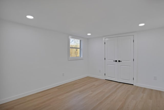 interior space with recessed lighting, light wood-style flooring, and baseboards