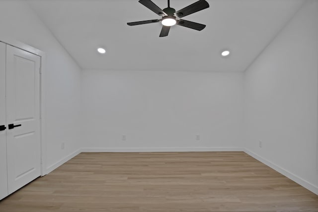 unfurnished room featuring light wood-type flooring, baseboards, and recessed lighting