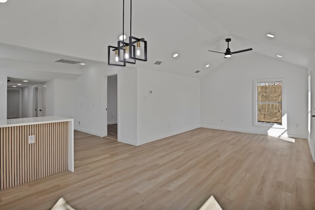 unfurnished living room with lofted ceiling, light wood-style floors, and visible vents