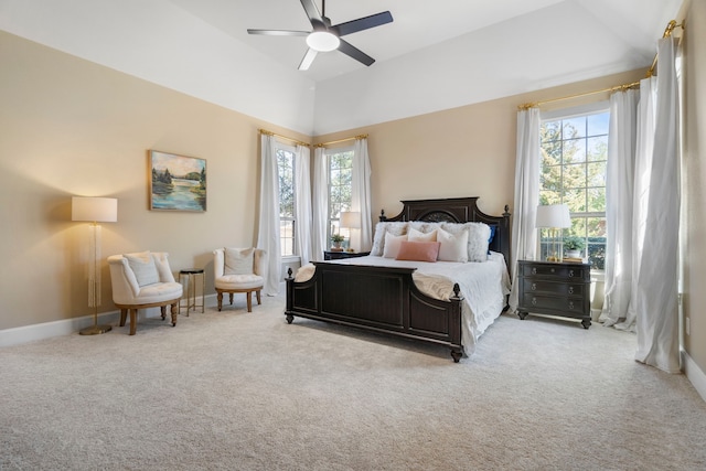 carpeted bedroom featuring lofted ceiling, ceiling fan, and baseboards