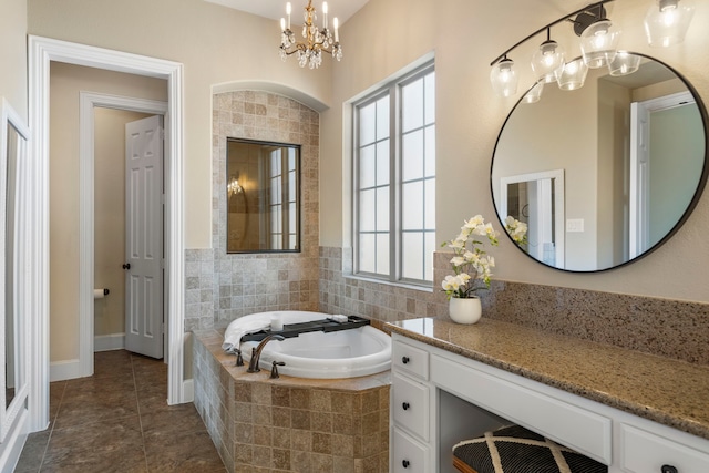 full bath featuring a garden tub, a notable chandelier, and tile patterned floors