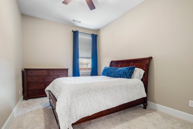 bedroom with carpet floors, visible vents, and baseboards