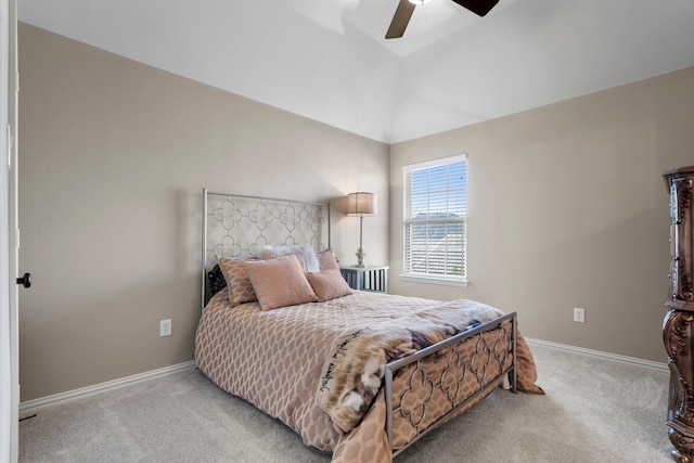 bedroom with lofted ceiling, ceiling fan, baseboards, and carpet flooring