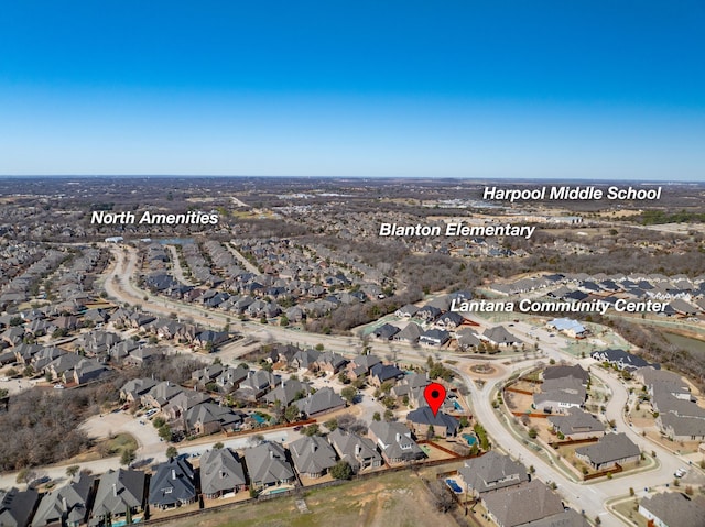 birds eye view of property with a residential view