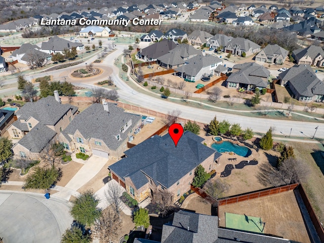 birds eye view of property with a residential view