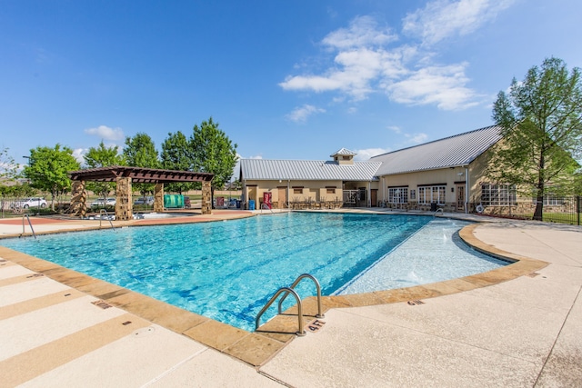 pool featuring fence, a patio, and a pergola