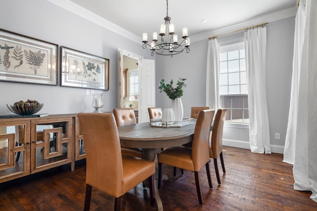 dining space with ornamental molding, plenty of natural light, and wood finished floors