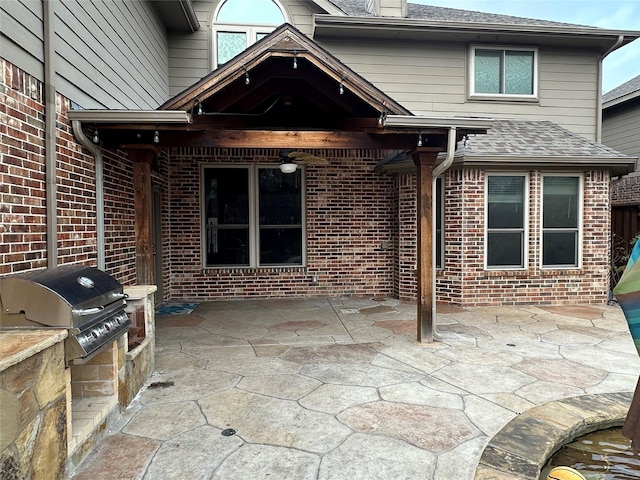 view of patio with exterior kitchen and area for grilling