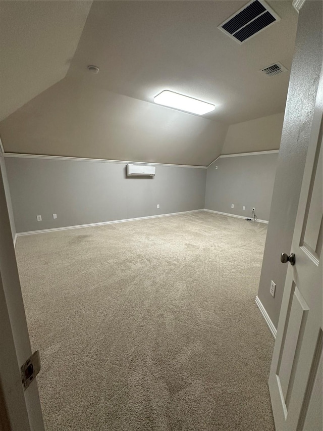 bonus room with visible vents, baseboards, lofted ceiling, and carpet floors