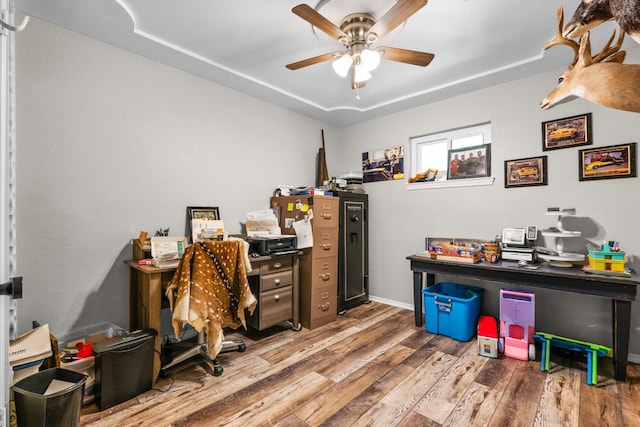 office area featuring a ceiling fan and wood finished floors