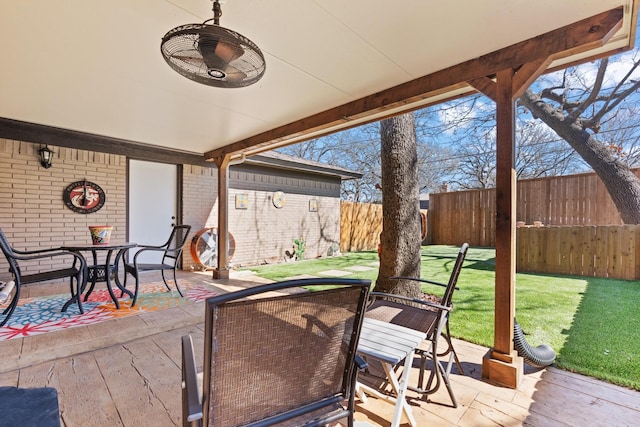 view of patio / terrace featuring outdoor dining area and fence