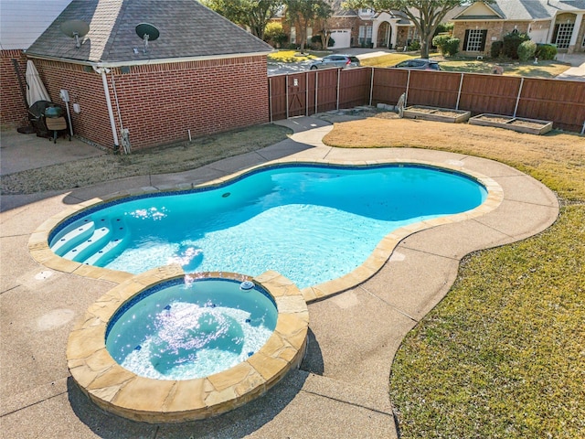 view of pool featuring a patio, a fenced backyard, and a pool with connected hot tub