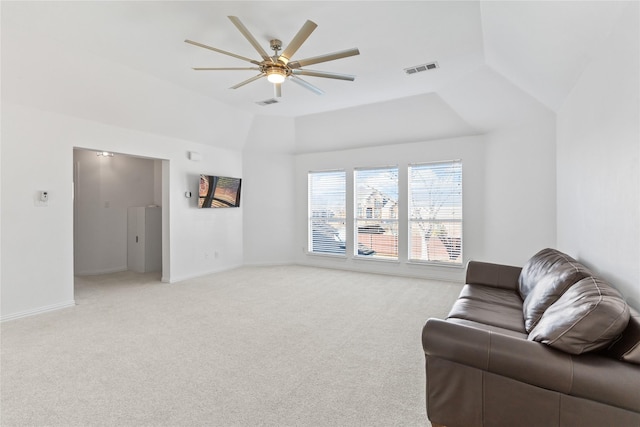 living area with light carpet, lofted ceiling, a ceiling fan, and baseboards