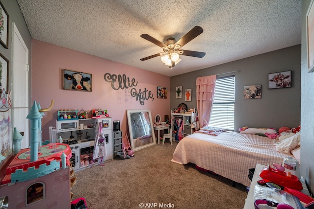 carpeted bedroom featuring a ceiling fan and a textured ceiling