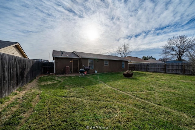 view of yard with a fenced backyard