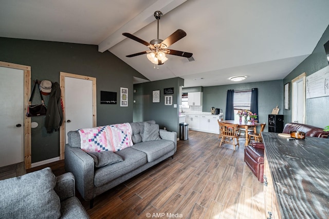 living room with vaulted ceiling with beams, ceiling fan, and wood finished floors