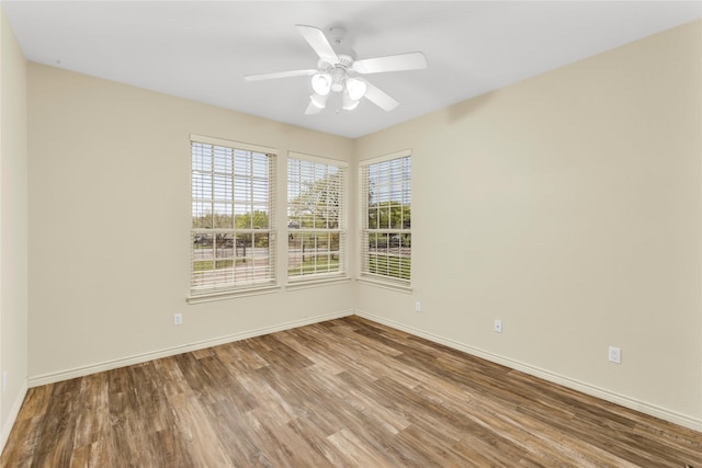 4031 Burleson Retta Rd, Burleson, TX 76028 - spare room featuring wood finished floors, baseboards, and a ceiling fan