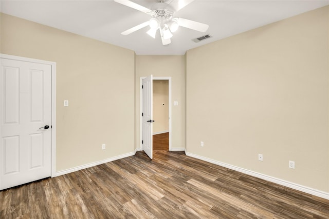 4031 Burleson Retta Rd, Burleson, TX 76028 - unfurnished bedroom featuring wood finished floors, baseboards, and a ceiling fan
