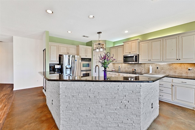 4031 Burleson Retta Rd, Burleson, TX 76028 - kitchen with appliances with stainless steel finishes, a large island with sink, tasteful backsplash, recessed lighting, and dark stone countertops