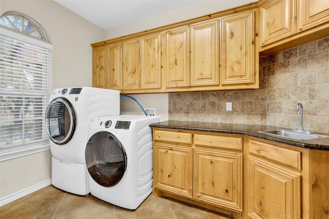 4031 Burleson Retta Rd, Burleson, TX 76028 - laundry room with cabinet space, washing machine and dryer, healthy amount of natural light, and baseboards