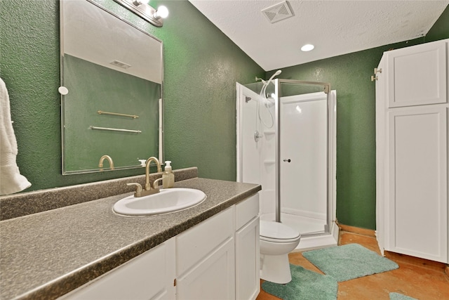 4031 Burleson Retta Rd, Burleson, TX 76028 - bathroom with a textured wall, a shower stall, toilet, vanity, and a textured ceiling