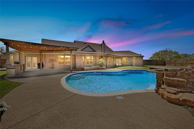 4031 Burleson Retta Rd, Burleson, TX 76028 - view of swimming pool featuring a patio, fence, french doors, and exterior kitchen