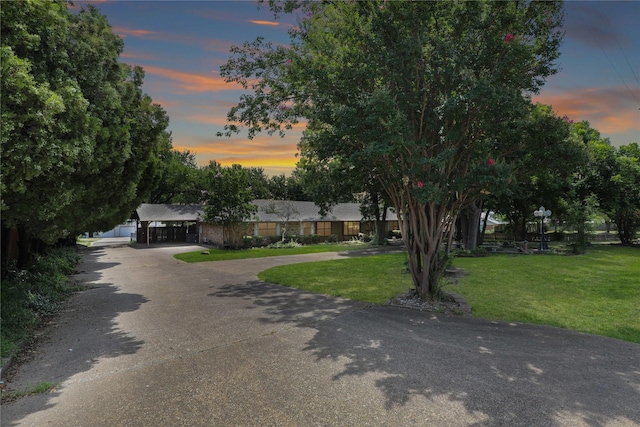 view of front of house featuring a front yard and driveway