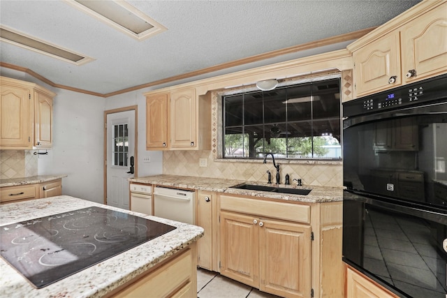 kitchen with decorative backsplash, light brown cabinetry, ornamental molding, a sink, and black appliances