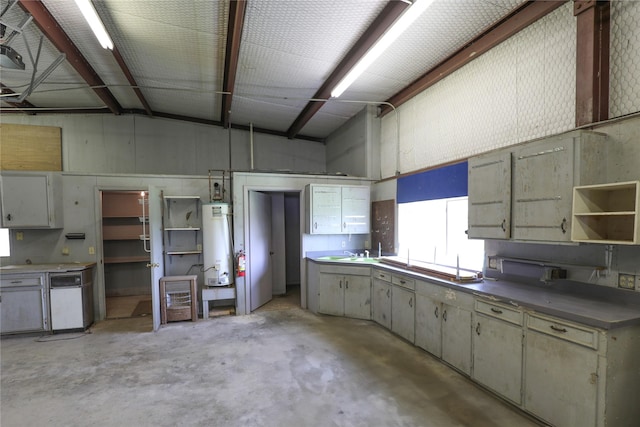 kitchen featuring water heater, metal wall, concrete floors, open shelves, and a sink