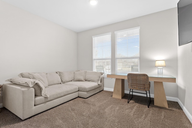 carpeted home office featuring baseboards