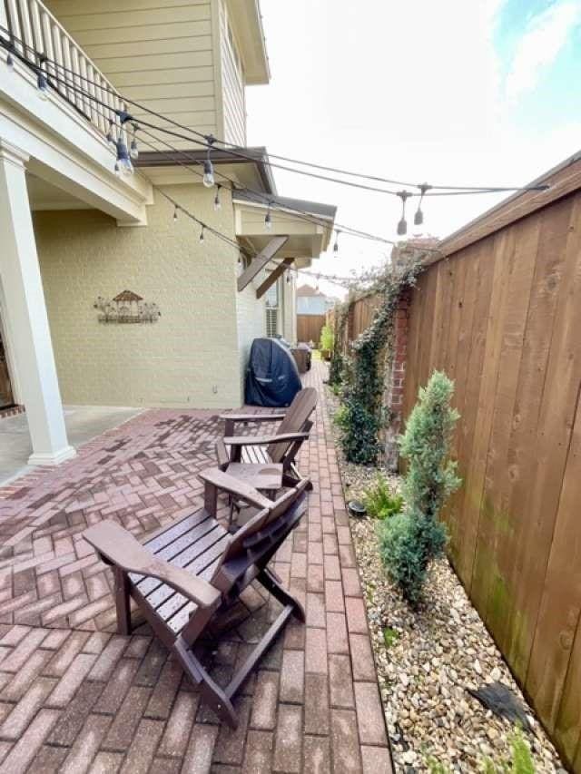 view of patio featuring fence