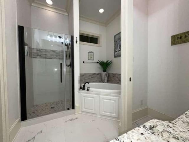 1933 Woodberry Ave, Shreveport, LA 71106 - bathroom with recessed lighting, crown molding, a shower stall, marble finish floor, and a garden tub