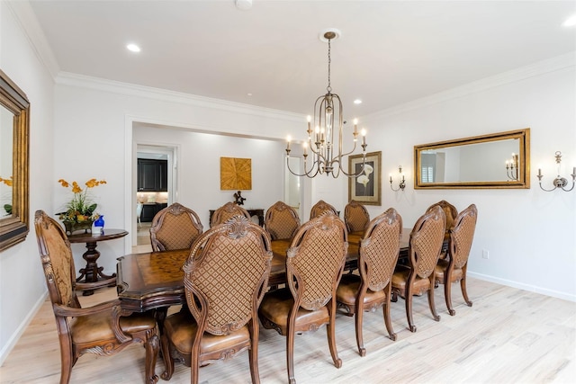 dining area featuring ornamental molding, light wood finished floors, recessed lighting, and baseboards