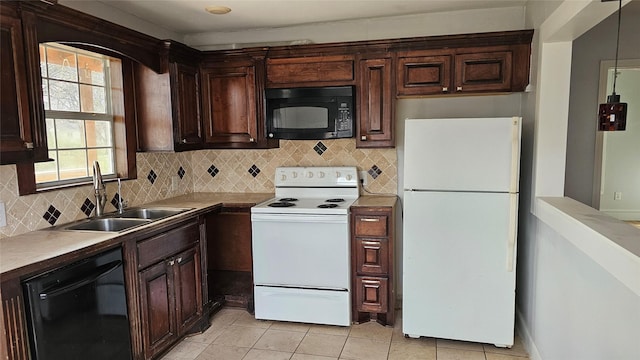 kitchen with black appliances, dark brown cabinets, backsplash, and a sink