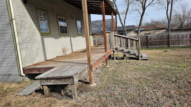 view of yard with fence and a deck