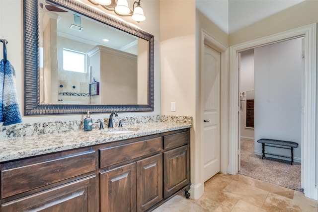 bathroom featuring baseboards, a shower, crown molding, vanity, and a chandelier