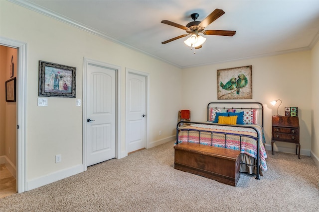 bedroom with ornamental molding, carpet, and baseboards