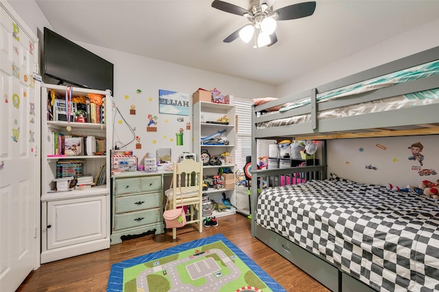 bedroom with a ceiling fan and wood finished floors