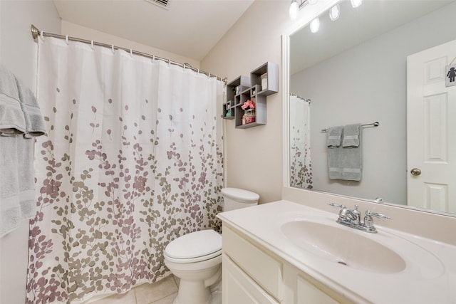 bathroom featuring curtained shower, vanity, toilet, and tile patterned floors