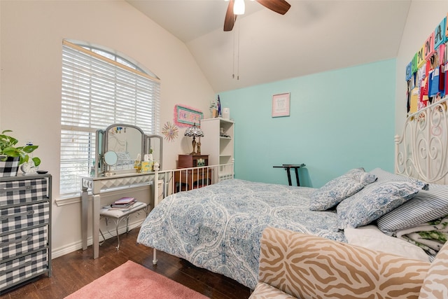 bedroom with ceiling fan, multiple windows, vaulted ceiling, and wood finished floors