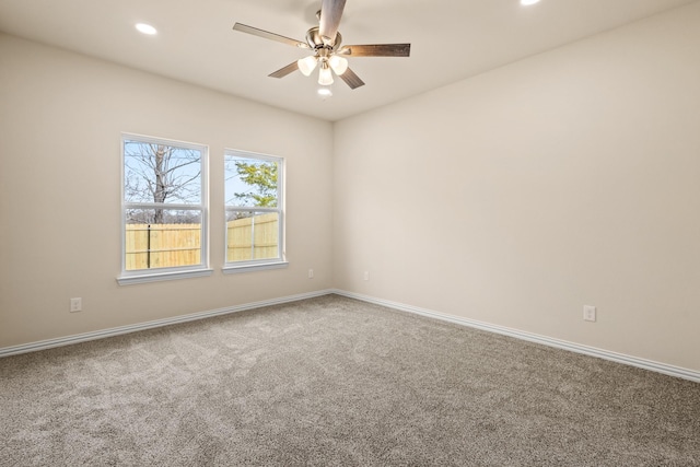 unfurnished room with recessed lighting, carpet flooring, ceiling fan, and baseboards