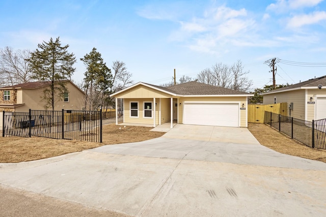 view of front of property featuring driveway, a garage, fence, and board and batten siding