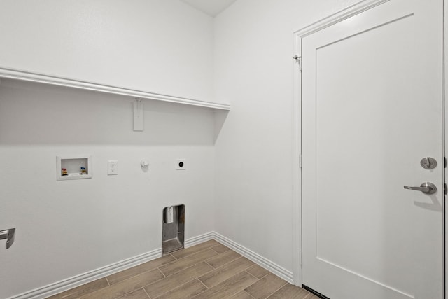 washroom with hookup for a gas dryer, laundry area, washer hookup, wood tiled floor, and electric dryer hookup