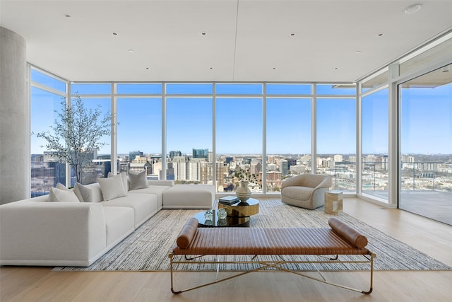 sunroom / solarium with a healthy amount of sunlight and a city view