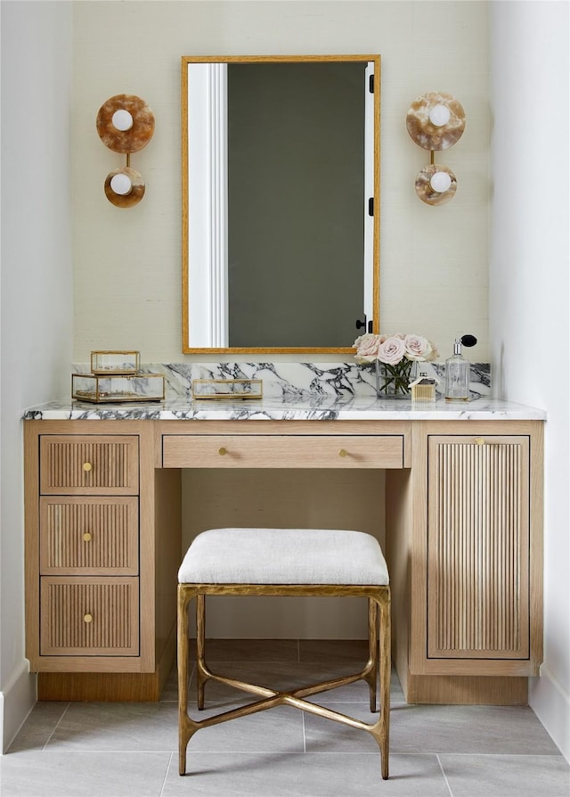 bathroom with tile patterned flooring and vanity