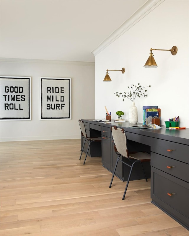 office space with light wood-style flooring and crown molding