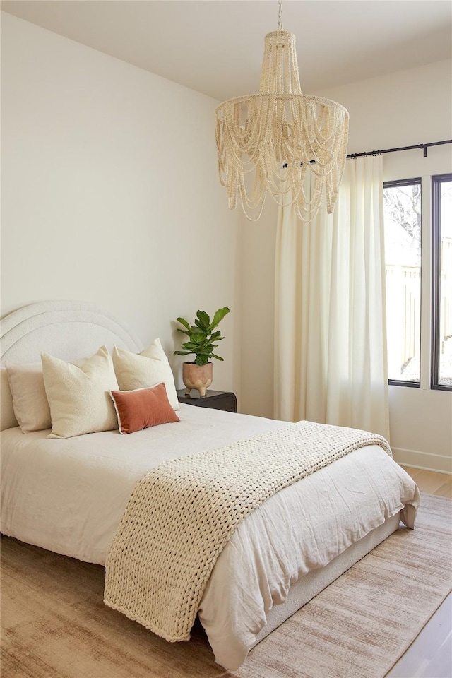 bedroom with an inviting chandelier