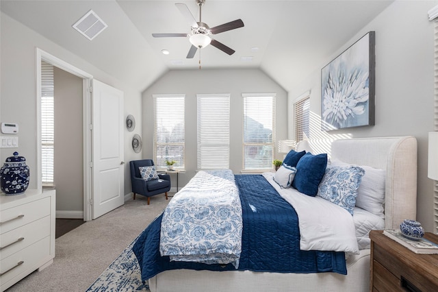 carpeted bedroom featuring lofted ceiling, visible vents, ceiling fan, and baseboards