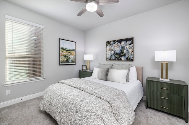 bedroom with carpet floors, baseboards, and a ceiling fan